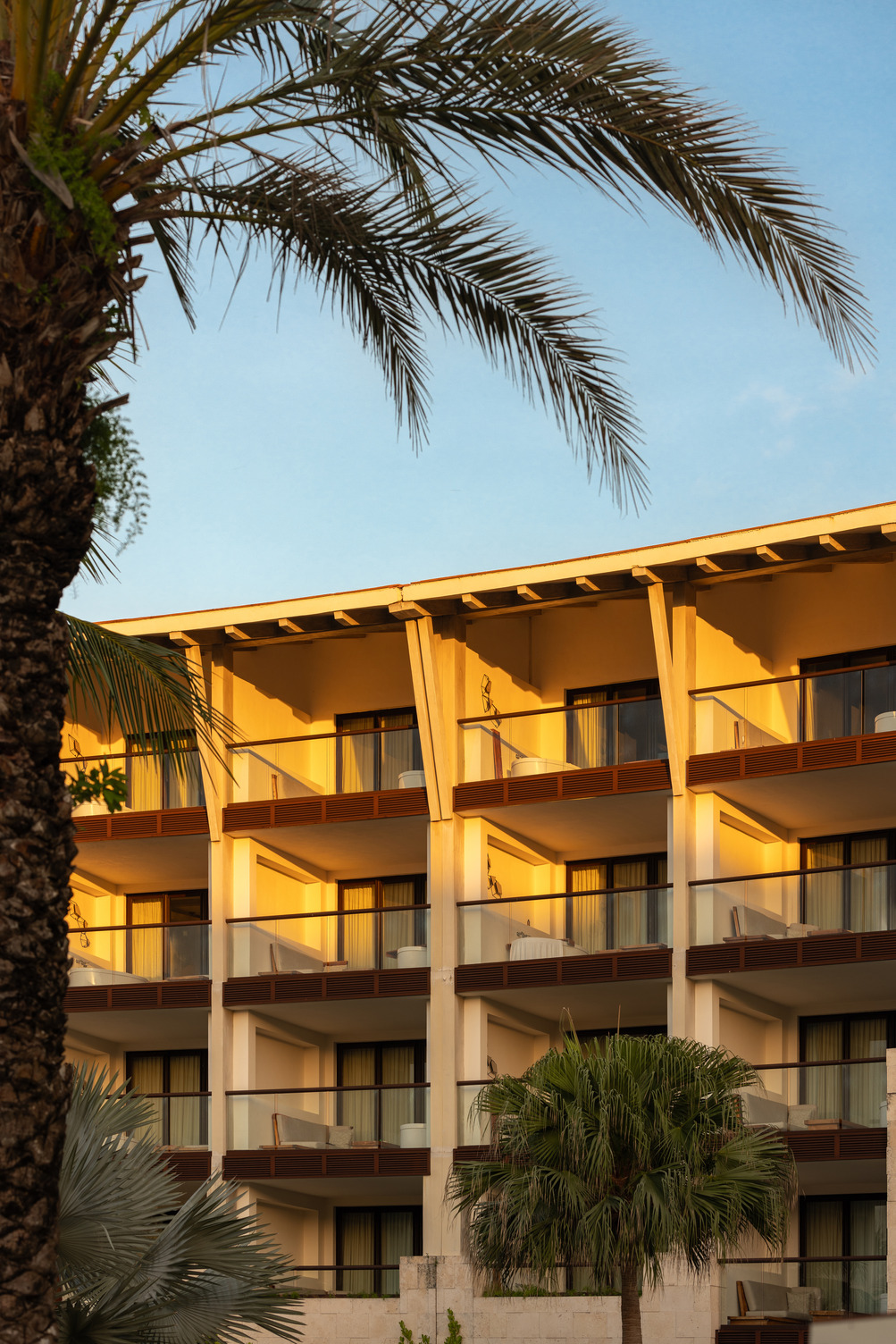 Exterior of UNICO hotel, showing room balconies in Riviera Maya Mexico.